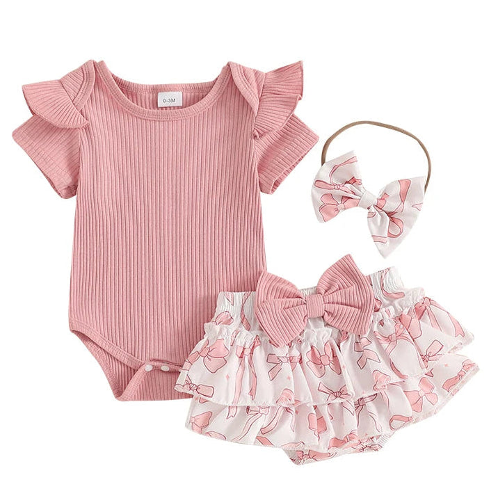 Pink baby girl outfit with ribbed flutter romper and layerded ruffle skirt