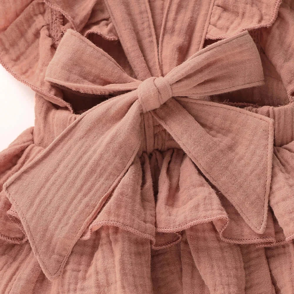 Closeup of Jennifer Ruffle Baby Girl Romper showing bow at the back