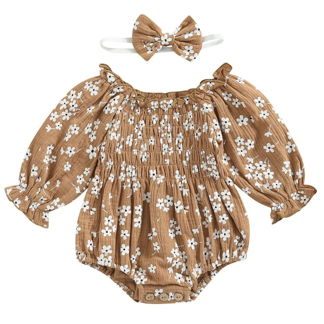 Sadie smocked daisy print romper in tan with puff sleeves and matching bow headband