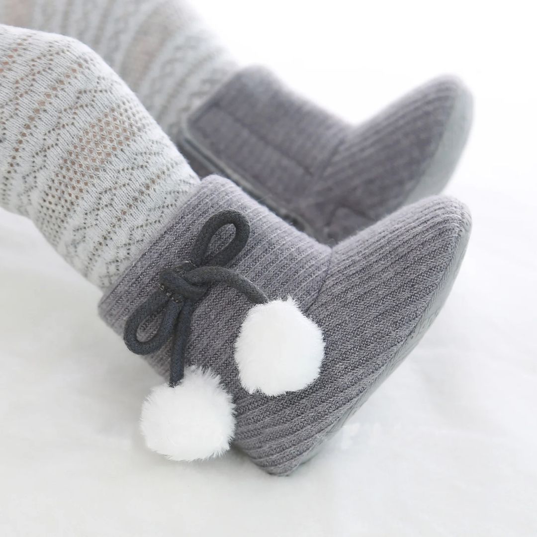 Grey baby ugg boots with pom pom bow