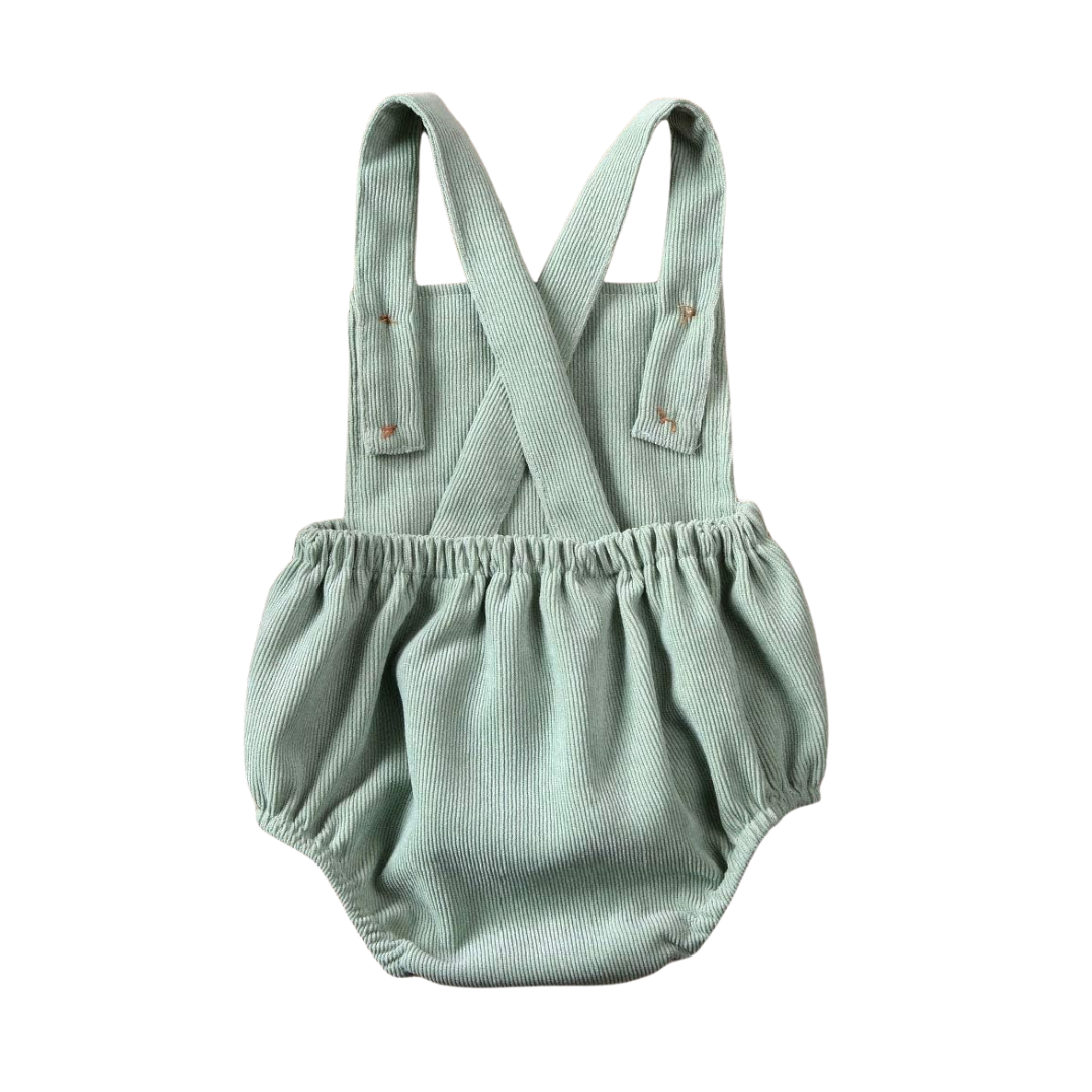 Baby Romper in mint green - back view showing backless design with criss-cross straps