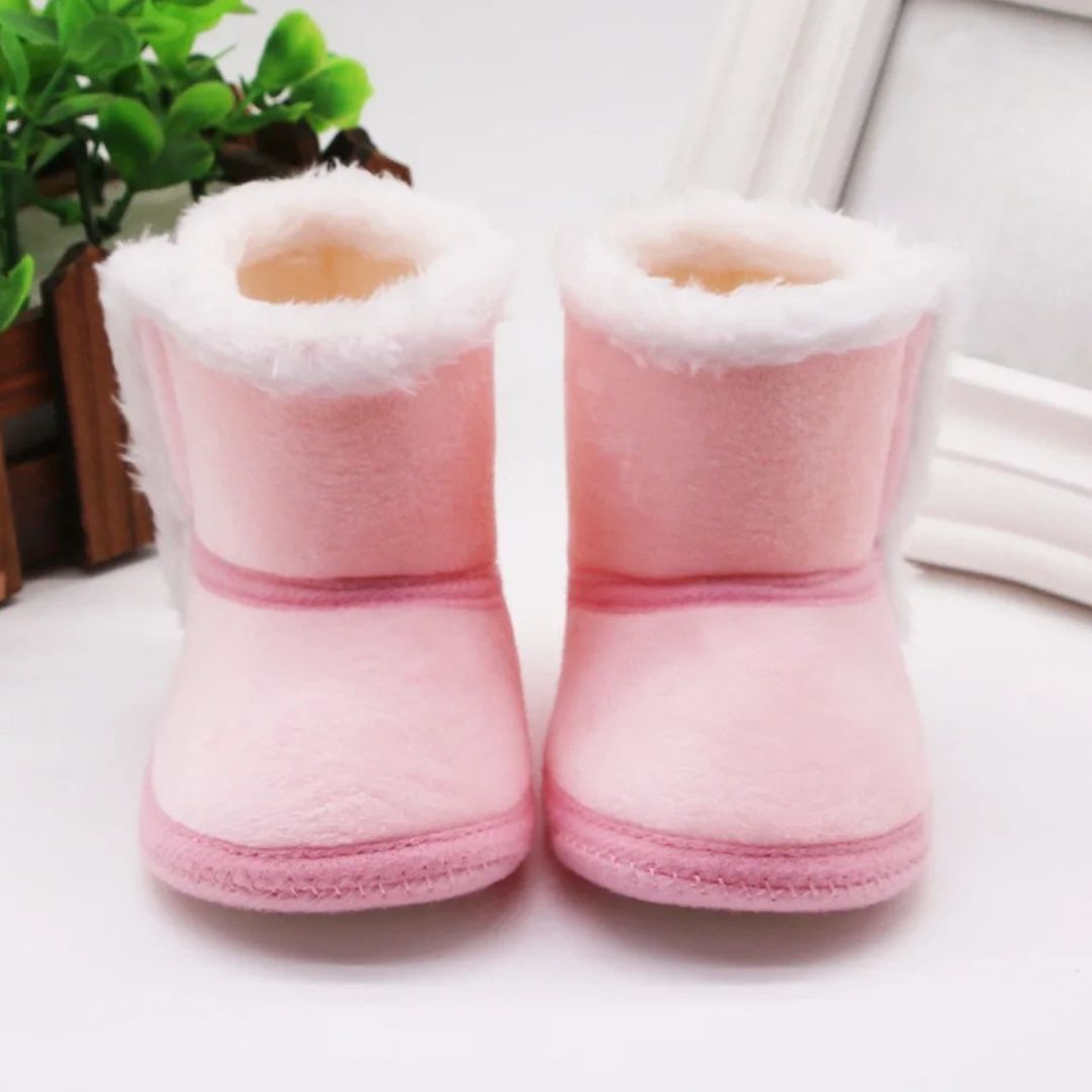 Pink baby slipper boots for warmth and comfort, perfect winter baby booties for pre-walkers.