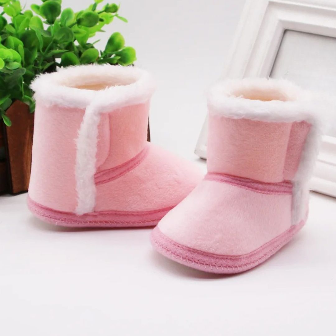 Pink baby slipper boots with fluffy lining, perfect winter baby booties for warmth and comfort.