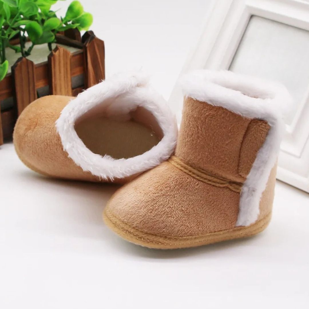 Tan baby slipper boots with soft fleece lining, perfect winter baby booties for tiny toes.