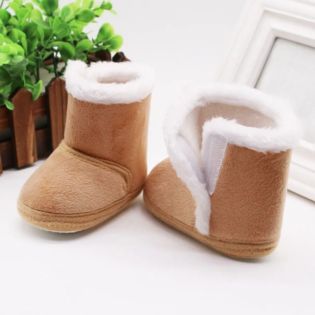 Tan baby slipper boots with fluffy lining, perfect winter baby booties for warmth and comfort.