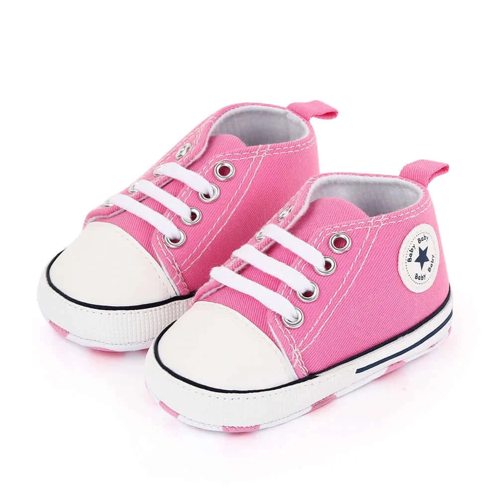 Pink baby sneakers with star logo