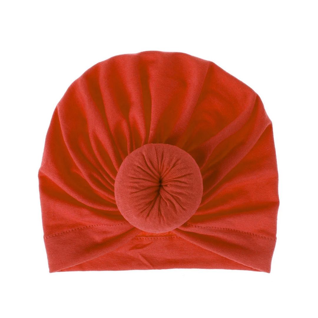 Olivia Top Knot Headband for baby girls in burnt orange colour, soft stretch fabric, stylish top knot design