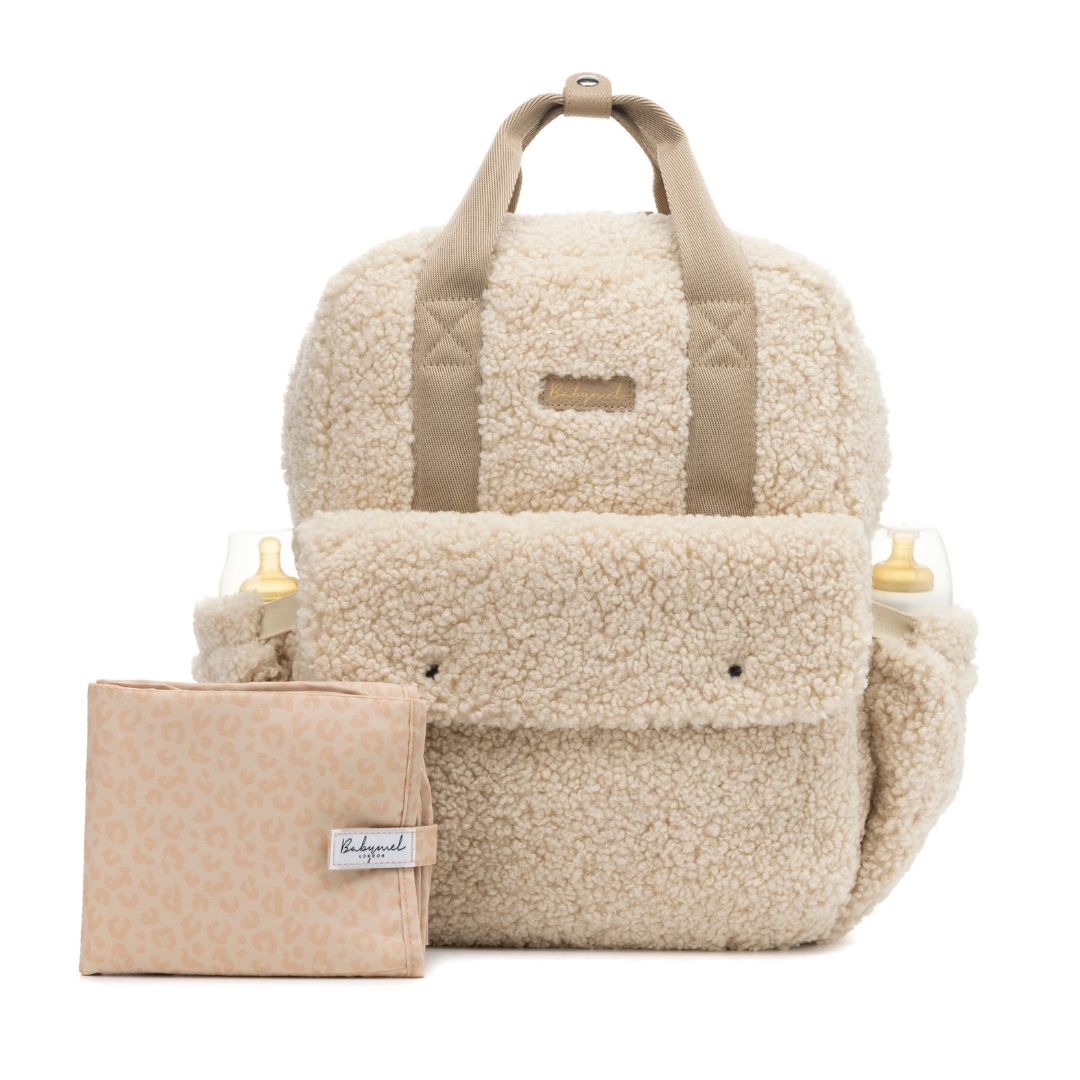 Babymel Teddy Nappy Backpack in soft fleece with matching changing mat, stylish and practical for parents.