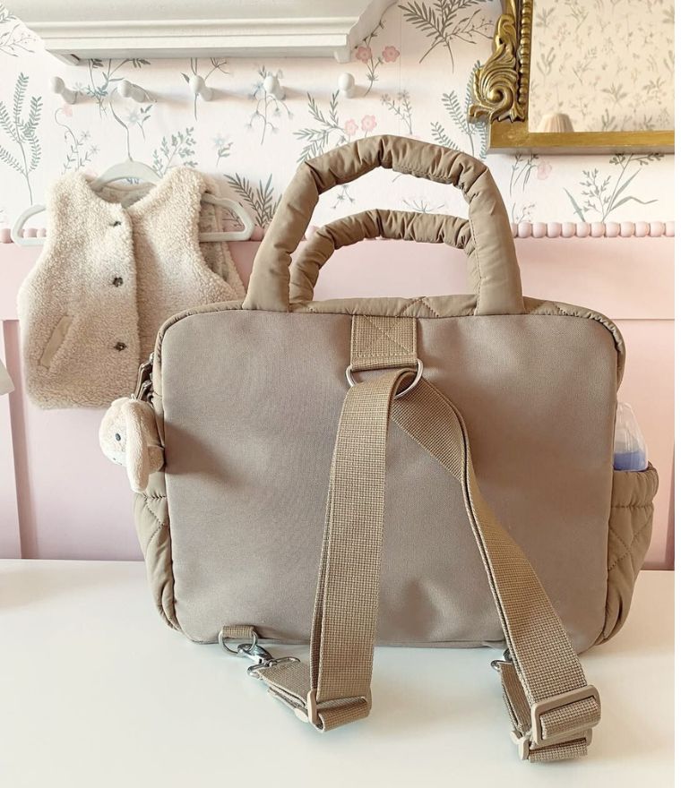 Babymel Willow quilted nappy bag tote in oat - back view, lifestyle image