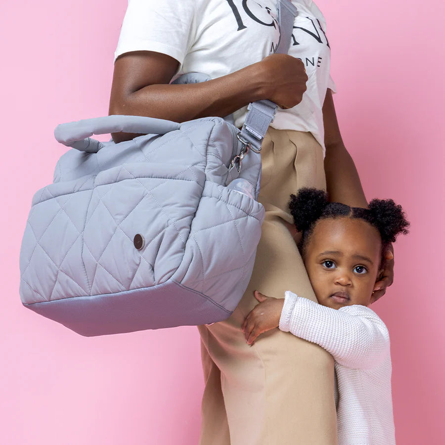Babymel Willow Nappy Bag in Oat colour - lifestyle image of mum and child