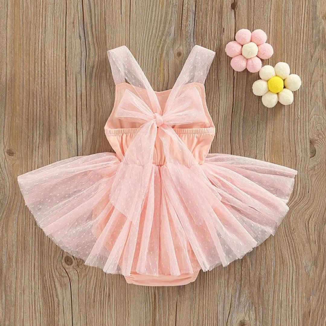 Ballerina Tutu Romper in soft pink with a bow, perfect for little girls' special occasions and play.