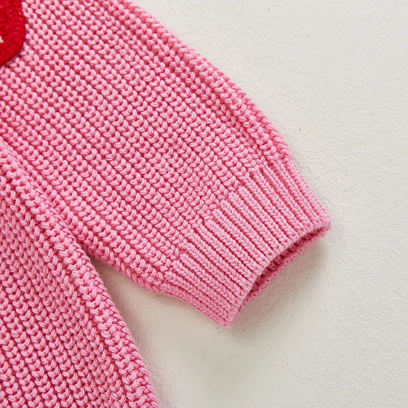 Closeup of big sister pink strawberry jumper showing knit sleeve