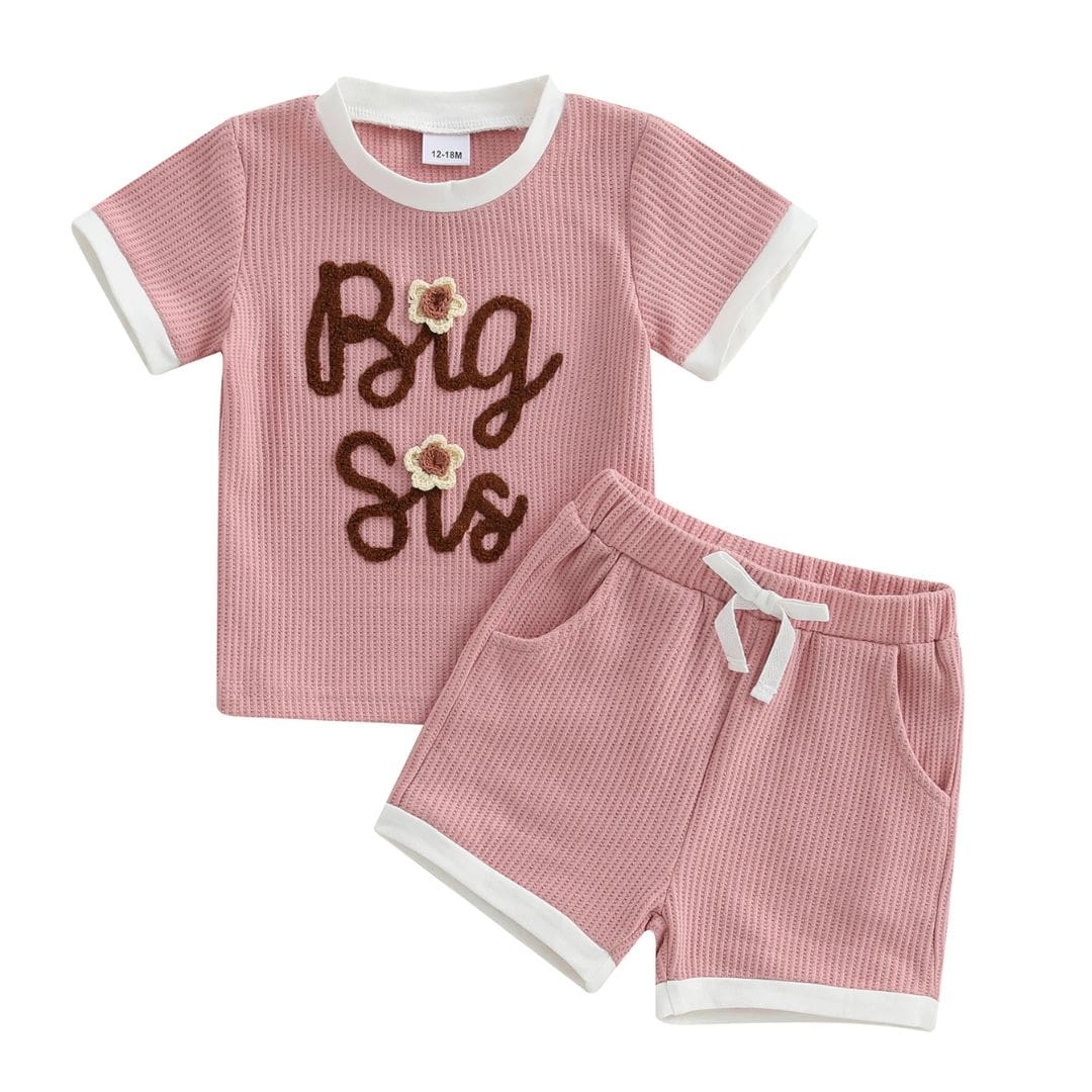 Big Sis Pink Shorts Set featuring waffle-textured top and shorts with side pockets, perfect for celebrating big sisters.