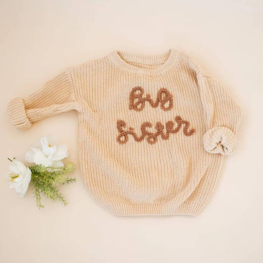 Big Sister Jumper in beige for girls 1-5 years styled flat lay