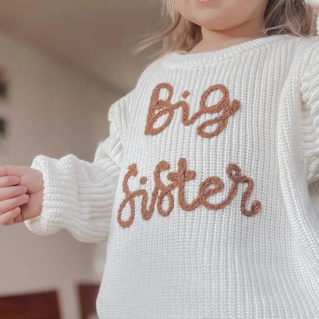 Girl wearing Big Sister Jumper in white
