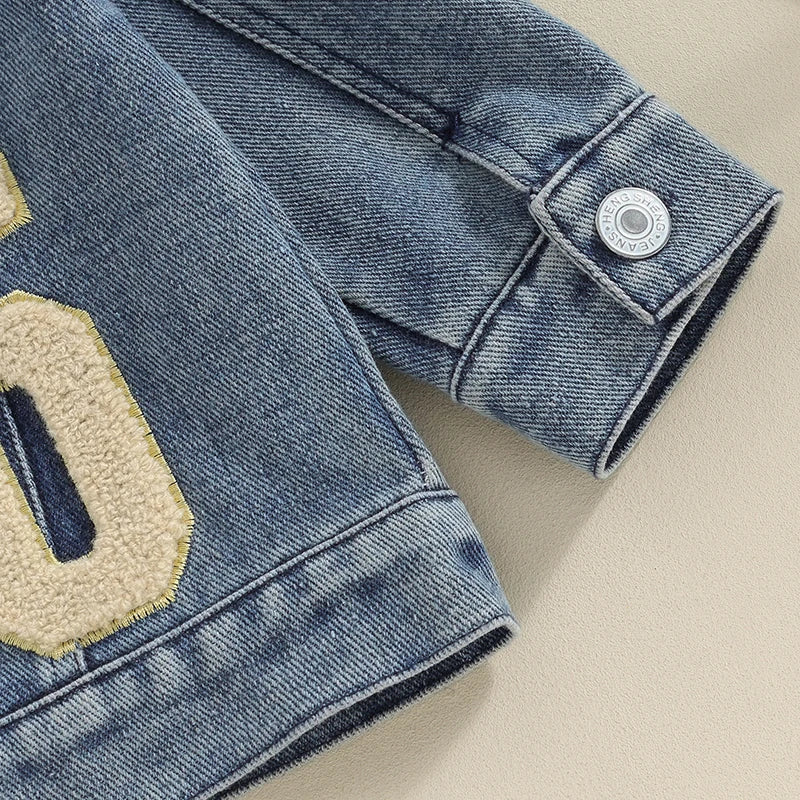 Matching sibling denim jackets - closeup