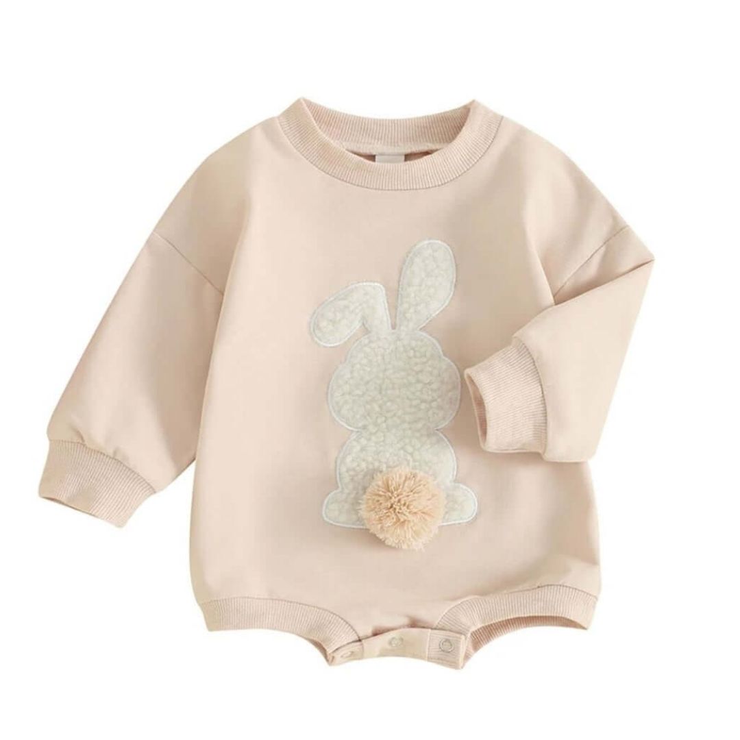 Beige baby romper with white bunny appliqué and pom-pom tail