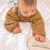 Baby boy wearing knitted jumper in mustard - Lulu Babe