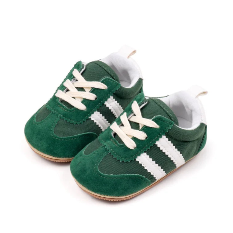 Classic stripe baby sneakers in vibrant green, stylish athletic shoes for babies aged 0-18 months.