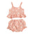 Daisy Ruffle Peplum Set in peach featuring a sleeveless top and ruffled shorts, perfect for sunny days.