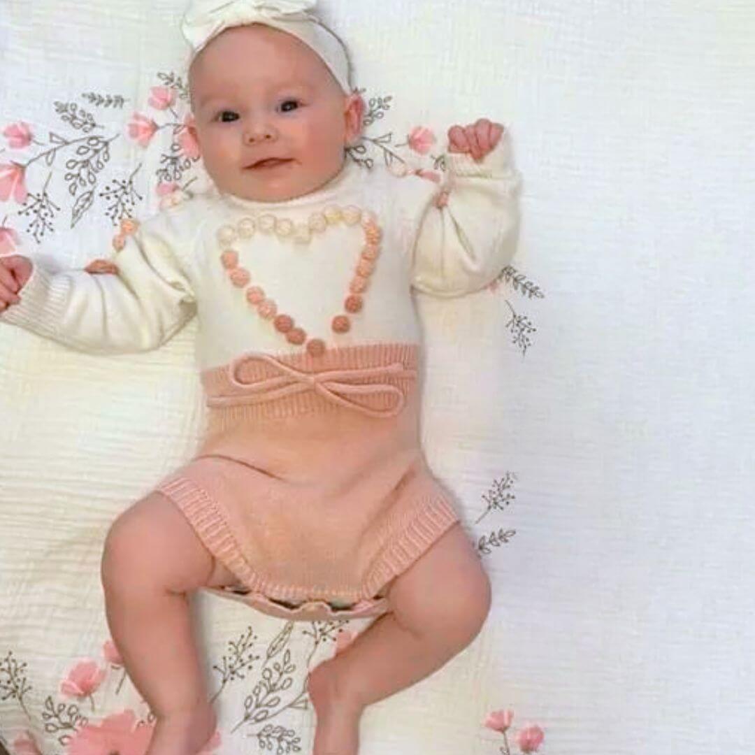 Girl wearing Emily Knit Baby Romper in pink - Lulu Babe