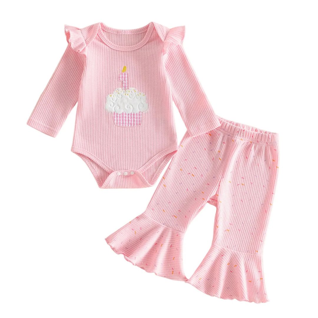 Pink ribbed first birthday outfit for baby girl with cupcake appliqué bodysuit and flare pants