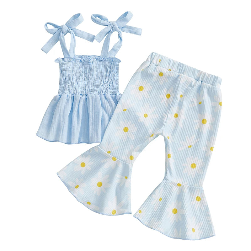 Vivian Floral Flare Baby Girl Outfit: Blue shirred top with bow-tie straps and flared pants with yellow polka dots, perfect for spring and summer.