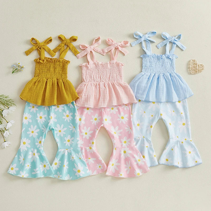 Vivian Floral Flare Girls Set, featuring shirred tops with bow-tie straps and flared pants with daisy print.