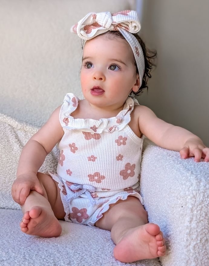 Baby girl wearing Genevieve Waffle Floral outfit in White