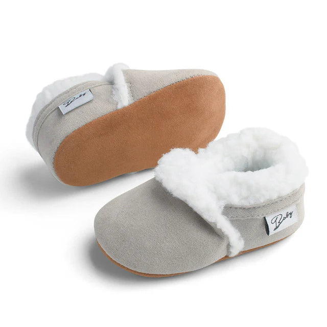 Grey fluffy baby moccasins with non-slip soles