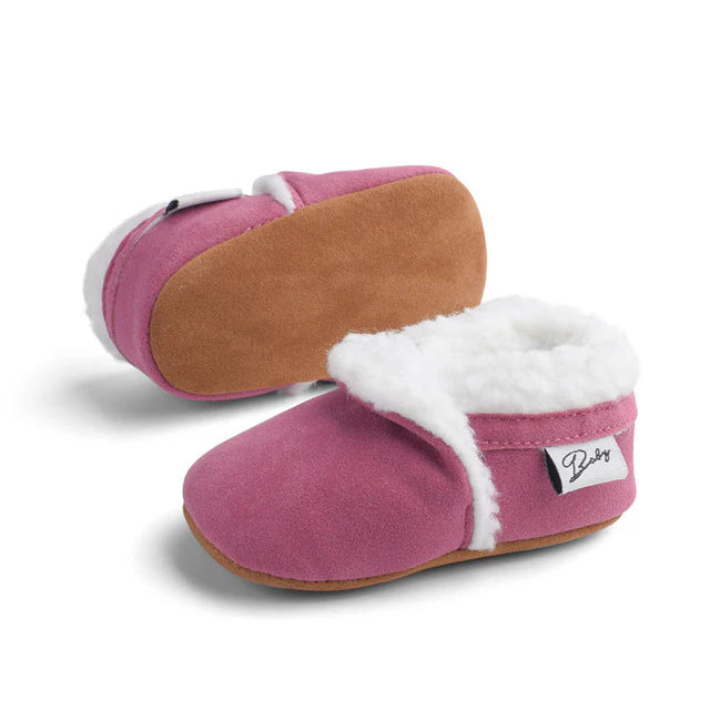 Fluffy baby moccasins in rose pink
