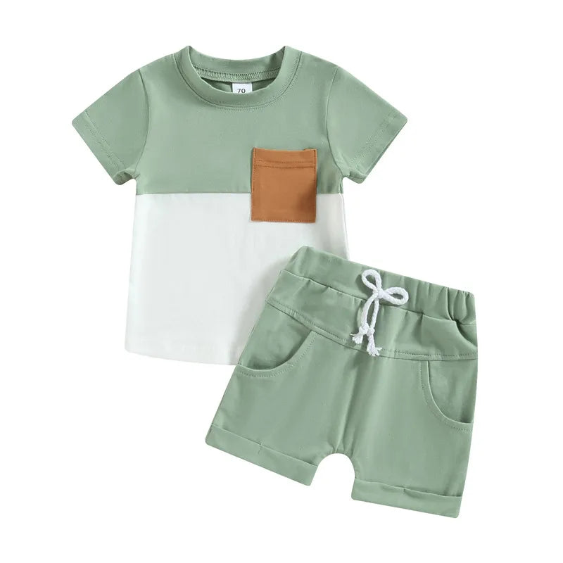 Fynn Colour Block Shorts Set for boys, featuring a green T-shirt with contrast pocket and matching shorts, perfect for toddlers.