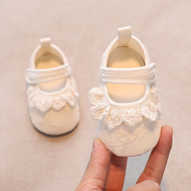 Ivory lace baby shoes with floral embroidered trim and velcro strap