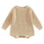 Chunky knit baby romper in beige with long sleeves and button closure, perfect winter essential for comfort and style.