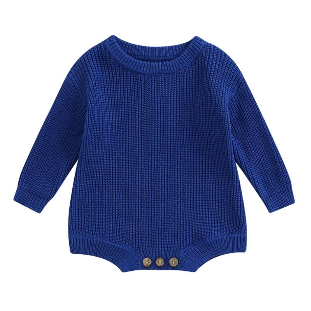 Chunky knit baby romper in blue with long sleeves and button details, perfect for winter snuggles.
