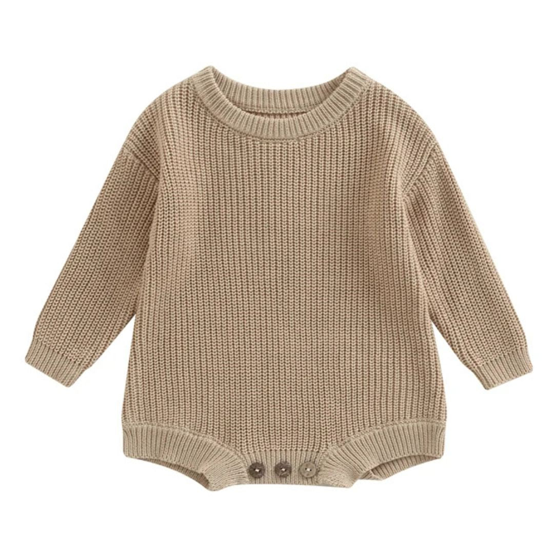 Chunky knit baby romper in latte, featuring long sleeves and textured knit, perfect for winter warmth and comfort.