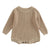 Chunky knit baby romper in latte, featuring long sleeves and textured knit, perfect for winter warmth and comfort.