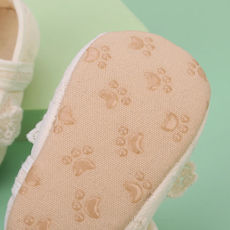 Soft anti-slip sole on ivory lace baby shoes for 0-18 months