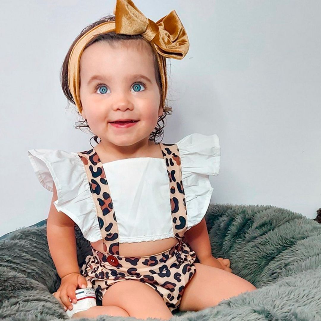 Baby girl wearing Leopard Pinafore Romper