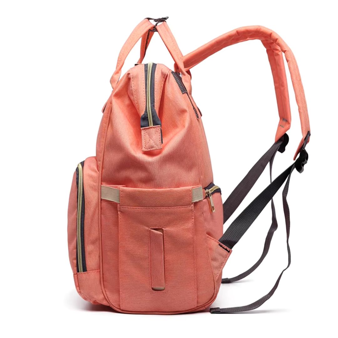 LeQueen Nappy Bag in coral colour - side angle showing the wipes pocket.