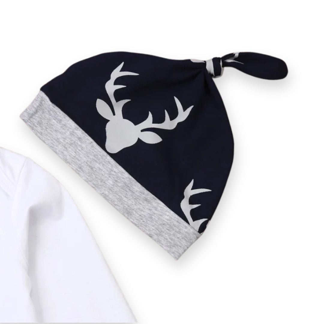 Comfy navy knotted beanie with deer antler print, matching grey band, perfect for baby's deer-themed outfit.