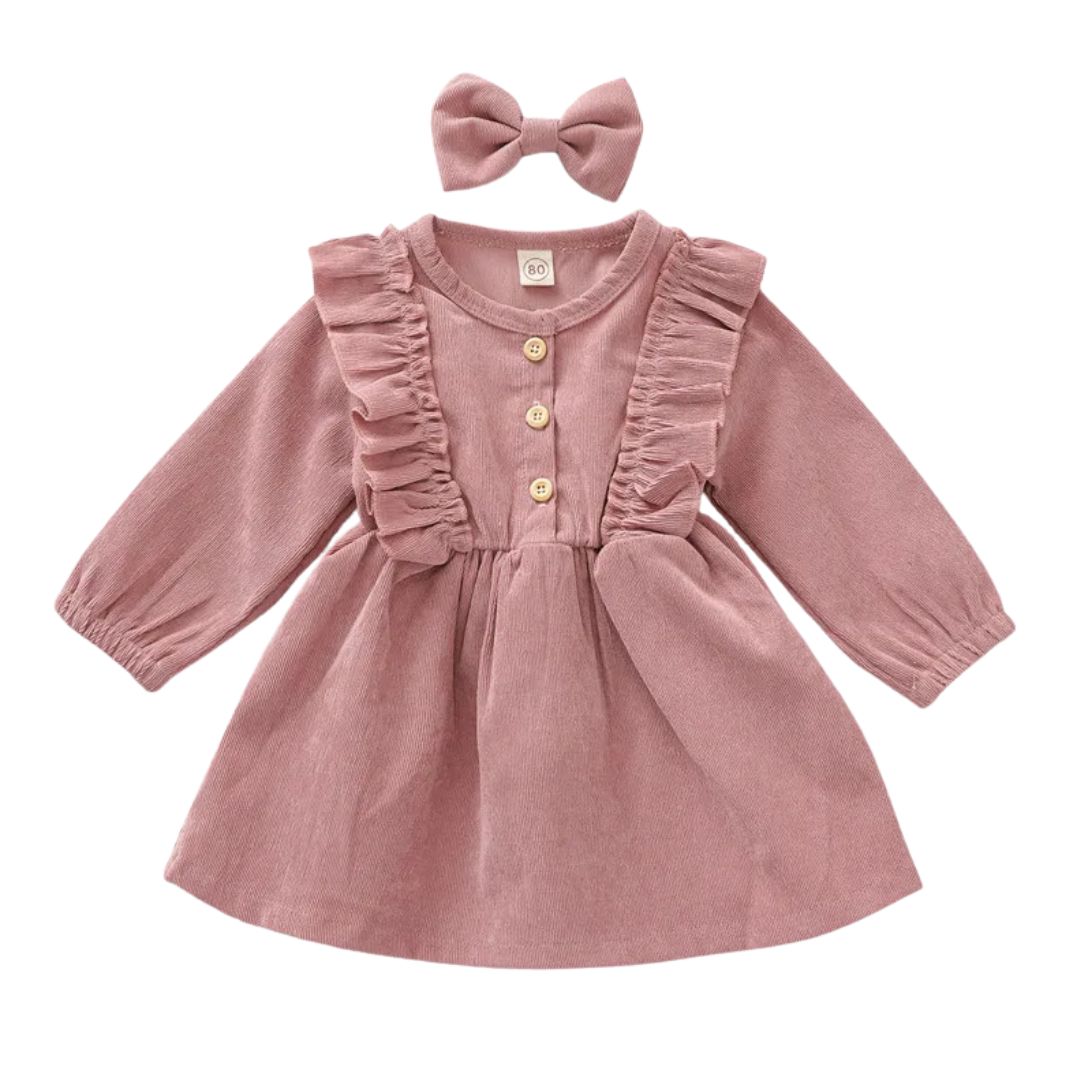Alice Corduroy Ruffle Dress in rose pink with long sleeves and matching bow, perfect baby girl winter dress.