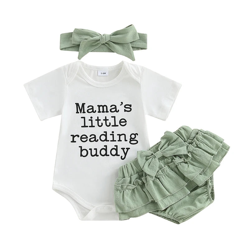 Baby girl outfit with 'Mama's little reading buddy' bodysuit, green ruffled bloomers, and headband.