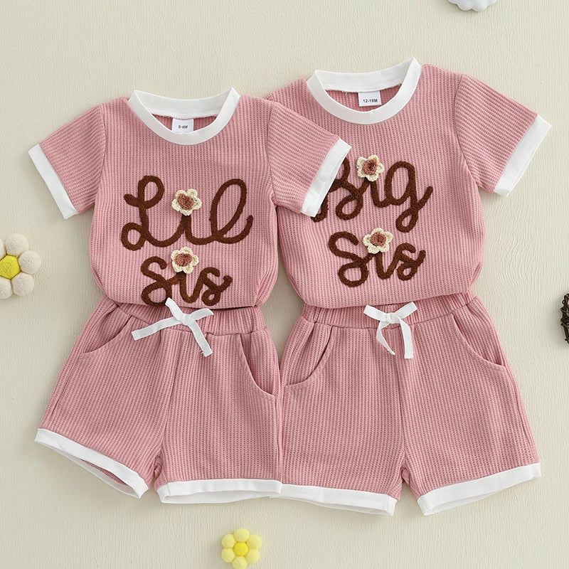 Matching Lil Sis & Big Sis outfits with pink waffle top and shorts