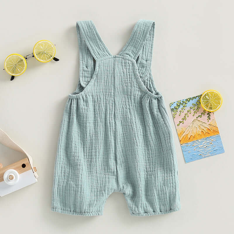 Cotton muslin baby romper in sage green - back view