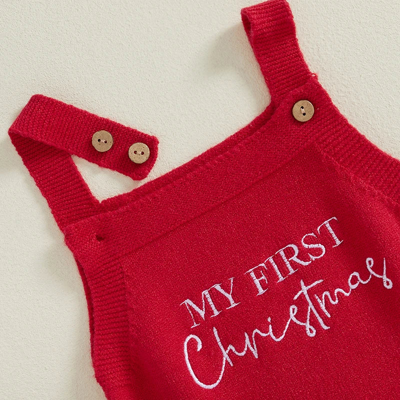 Closeup view of My First Christmas Romper in red, showing the adjustable straps with two button positions
