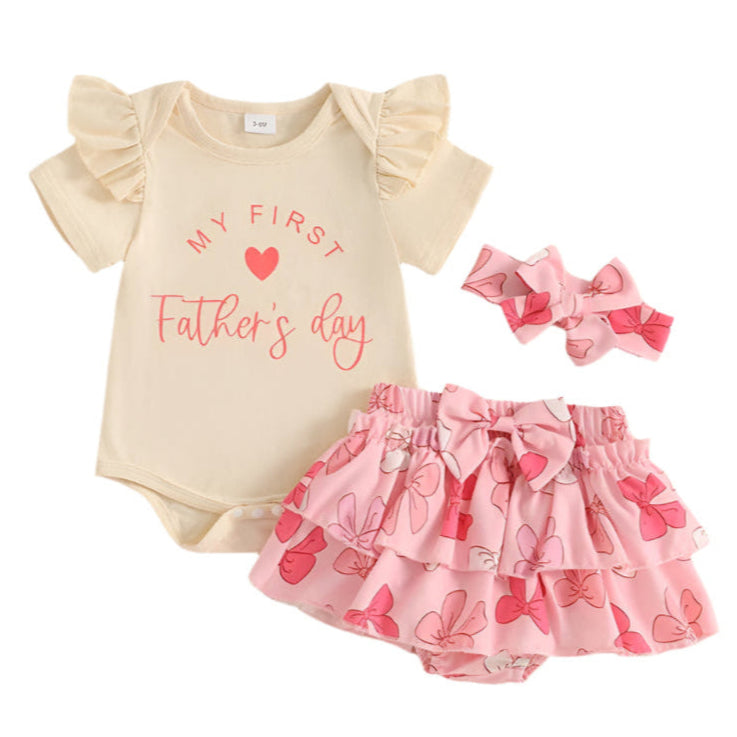 My First Father's Day ruffle set for baby girls, featuring a cream bodysuit, pink bow bloomer, and matching headband.