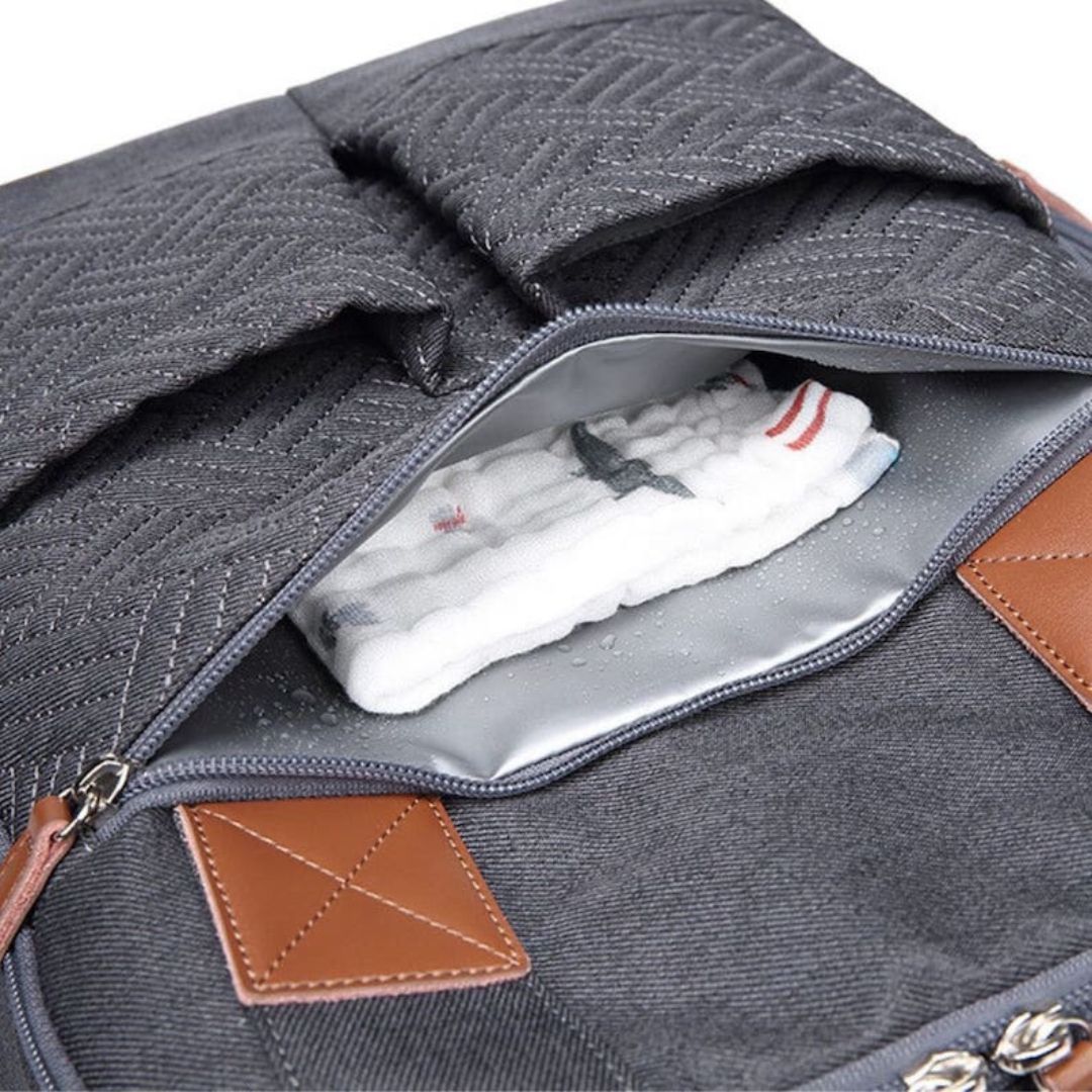Close-up of nappy backpack in charcoal with waterproof pocket