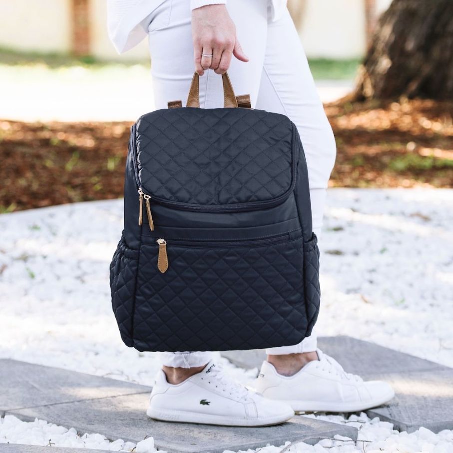 Lifestyle image of black quilted nappy backpack