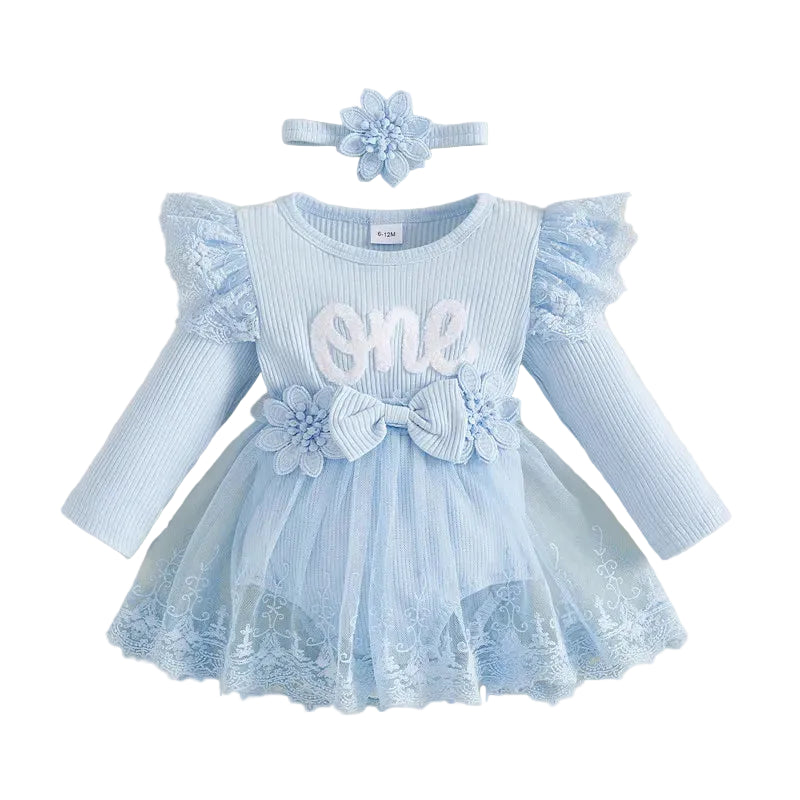 A baby girl's first birthday outfit set in light blue, featuring a long-sleeve ribbed top with lace ruffles, a matching tutu skirt with a large fabric bow at the waist, a floral headband.